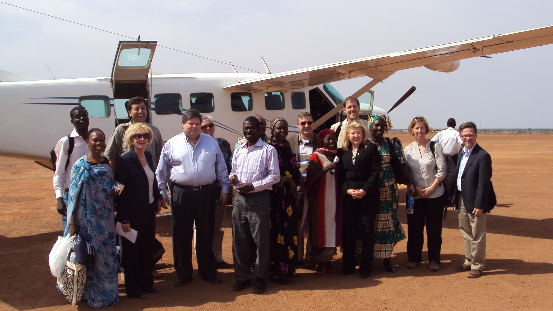 WDG staff and the visiting delegation at the airstrip
